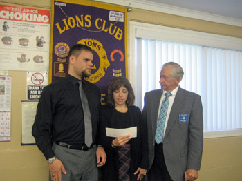 Ray Zylinski and Renee Diflavio from the Olmstead center accept a check from Barker Lions