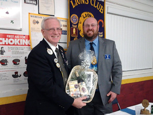 District Governor receives a bottle of wine 