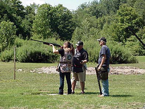 Doug Thompson giving tips and needed instruction to Barker shooters Tina Roberts and Rich Burley.